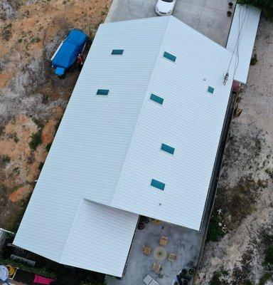 Bone White metal roof with seven skylights