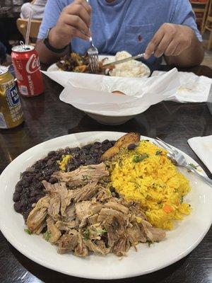 Pernil, yellow rice, Black Beans, plátano frito. Inca cola.