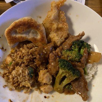 Plate of chicken fried rice, beef broccoli, pot sticker, and shrimp