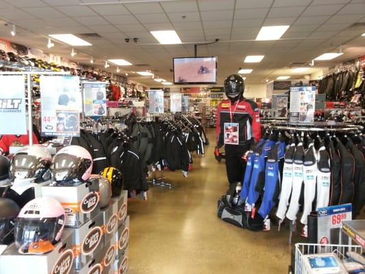 Straight view down the store towards the parts/accessory section in the back. Helmet on left side