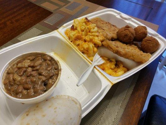 Butterfly Pork Chop mac-n-cheese and pinto beans  with hushpuppiees