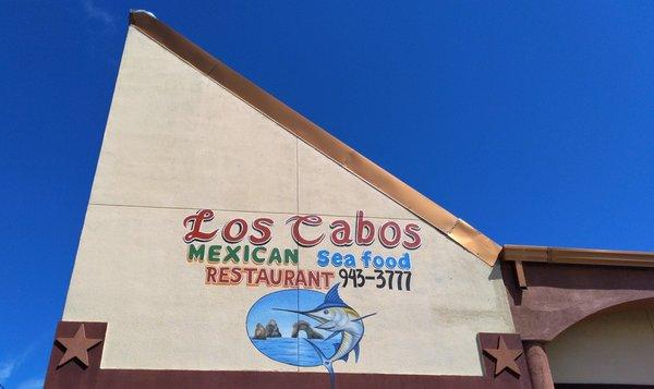 If you decide you want to eat here, look for this wedged roof and this logo.  (Look at the incredible sky that day.)