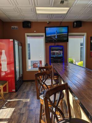 The bar at Chicago's.  No booze, but they have 2 TV's going