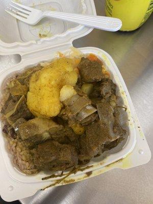 Small curry goat with rice & pease and steamed Veggie