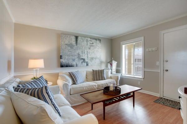 This top floor unit is beautifully remodeled bright with beautiful coastal colors.