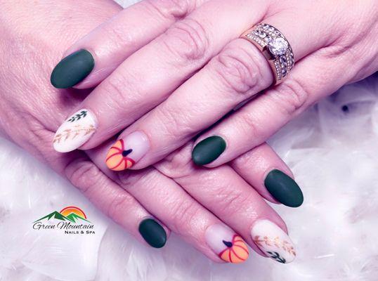 Dip powder nails with gel polish and pumpkin designs by Kim L.