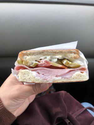 Queso fresco, jalapeños tomatoes lettuce and the bread is toasted.