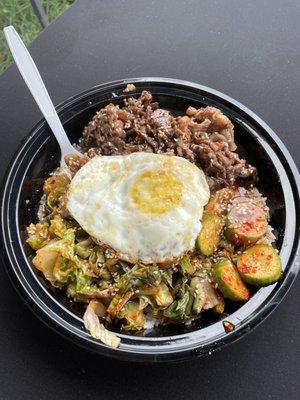 Bulgogi bowl with steamed rice and kimchi cucumbers!