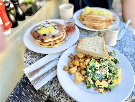 Spinach scramble, blueberry cornmeal pancakes and chicken omelet.