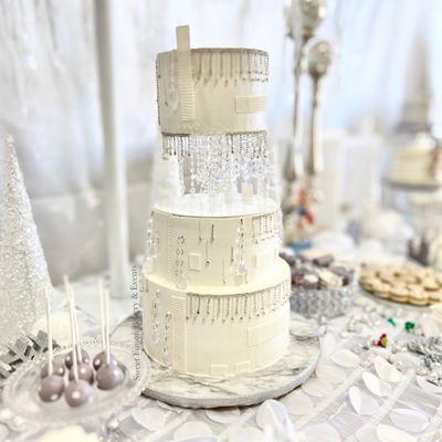 3 tiered winter wonderland themed cake with a floating top tier.