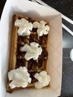 Waffle with chocolate and whipped cream.