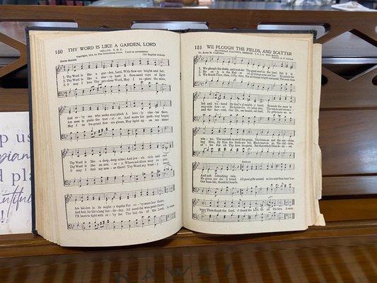 Antique hymnal - spelling of "plough" is one clue.  Shaped notes would be nice, but we'll still take it!