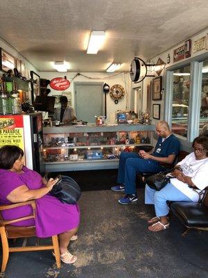 Busy day in waiting room. Get here early and look at antique car paraphernalia while waiting.