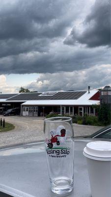 20oz Heifer glass with Rising Silo Brewery in the background