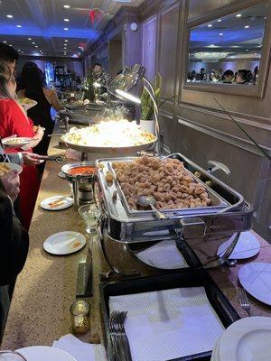 Hot food station calamari, leg of lamb, roasted beef, duck confit and seafood rice