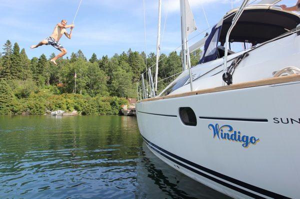 Enjoying the summer sun, warm water and smooth sailing boats at Superior Charters