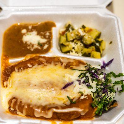 CHILE RELLENOS (2)  Dipped in egg batter and pan-fried, filled with Asadero cheese, topped with house sauce. Served with two sides.