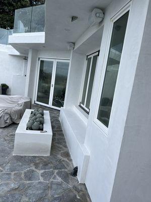 This is a smooth finish white color, in a private community in Laguna Beach .