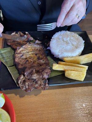 Steak plate with rice and fried yucca