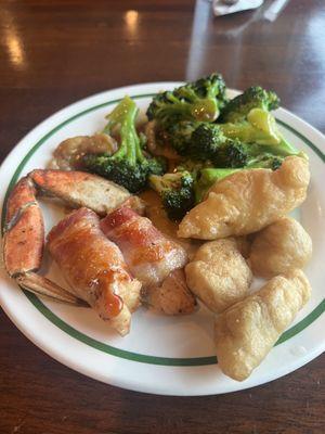 chicken wrapped in bacon, broccoli, crab leg, sweet and sour chicken