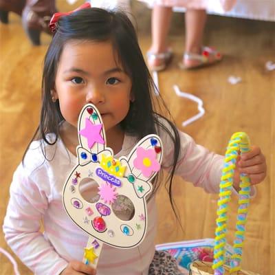 One of our dancers showing off her bunny mask and basket at our Spring Party!