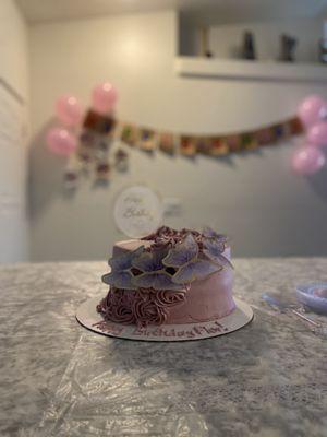 Strawberries and cream cake w floral designs and a happy birthday message!