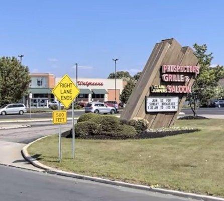 When traveling on Route 38 East, look for the Prospectors restaurant sign and pull into that parking lot entrance...