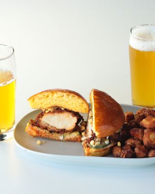 Nashville Hot Chicken Sandwich with corn relish, mayo all on a house-made Brioche bun.