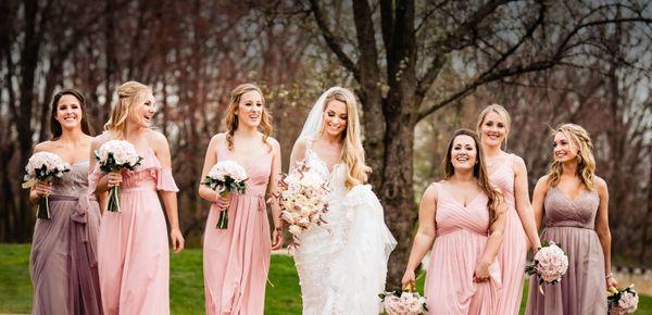 Bridal party walks through the gorgeous grounds in our outdoor wedding venue.