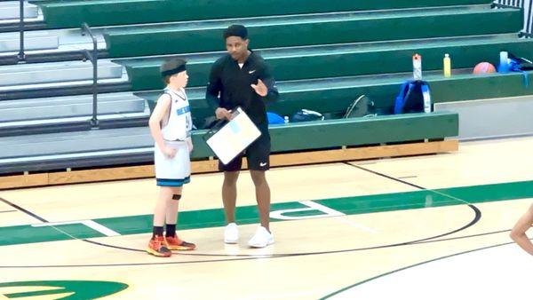 Our son talking to Coach Randall Jackson during Resilience Select Basketball Tournament in Spring 2024