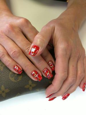 Beautiful handpainted designs over perfectly structured sculpted nails. Incredible talent and attention to detail.