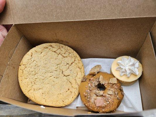 Peanut butter and jelly cookie, puppy donut and orange Creamsicle mini cheesecake