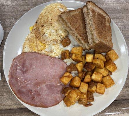 The Lodge Breakfast: eggs over easy, toat, ham, seasoned cubes