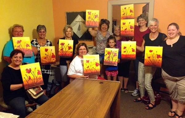 A happy bunch of artists after a painting class held at L.E.T.'s