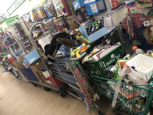 Crap just stuffed in shopping carts and left in the aisle.