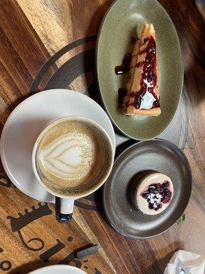 Latte, goat cheese tart, daily homemade cheesecake