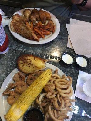 Fried shrimp, curly fries and corn.