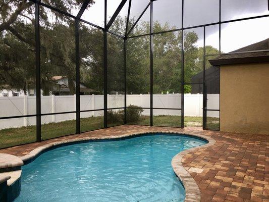 New built 2 story pool enclosure with paver patio in Riverview.