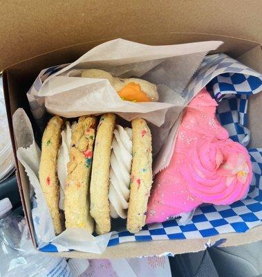 Confetti cookie sandwiches, champagne cake slice and frosted sugar cookie