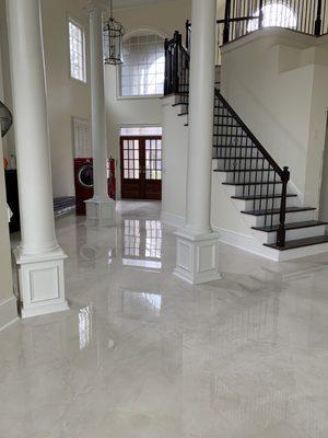 Photo of tiled floor with baseboard and staircase finished