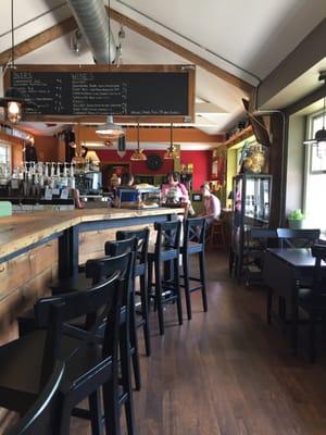 Comfy space and cool bar. Note the beer and wine chalkboard menu made out of a door above the bar.