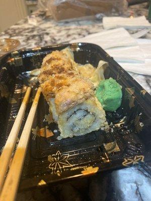 Crispy and spicy tuna roll special filled with just rice and the heat from the tempura cooker all the raw tuna