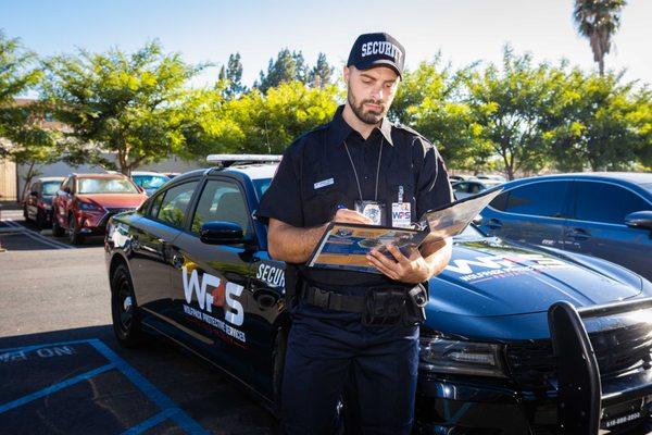 Wolfpack Protective Services guard checking identifications and permit entries at access points.