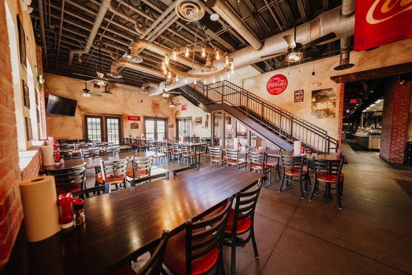 One of our three indoor dinning spaces. Located on the first floor, guests can find our self-serve beverage station and dessert station.