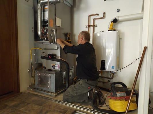 Randy working on the heat pump installation