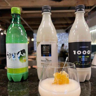 Enjoy Makgeolli! This traditional Korean rice wine is slightly sweet, lightly fizzy, and refreshingly delicious. A true taste of Korea.