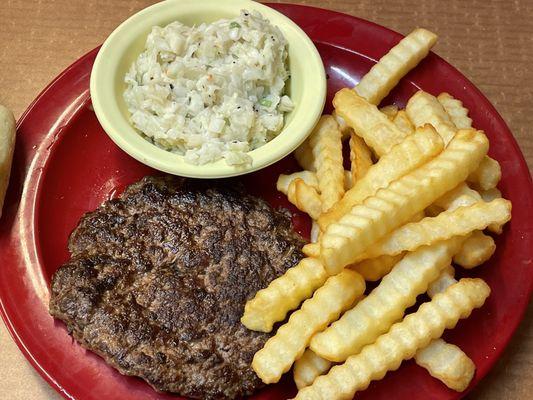 Hamburger steak, French fries and coleslaw.