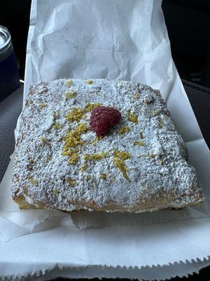 Some sort of french bread soaked in a citrus syrup. It is delicious!