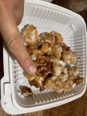 My itty bitty finger for contrast with these $20 measly walnut shrimp takeout (it wasn't even fried properly and cold)