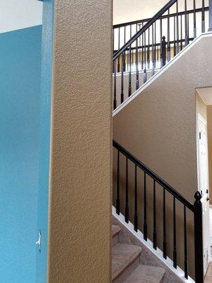 Gorgeous black railing and my peacock blue walls